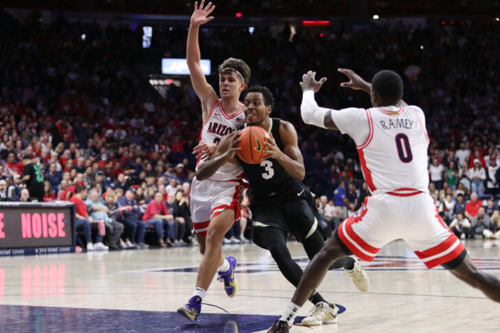 Colorado Buffaloes guard Jalen Gabbidon (3) drives to the net against Arizona Wildcats guard Kerr Kriisa (25) and guard Courtney Ramey (0) during the first half at McKale Center.