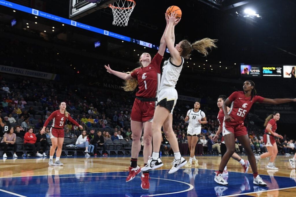 Washington State Cougars guard Tara Wallack (1) blocks a shot from Colorado Buffaloes guard Kindyll Wetta (15) in the fourth quarter at Michelob Arena.