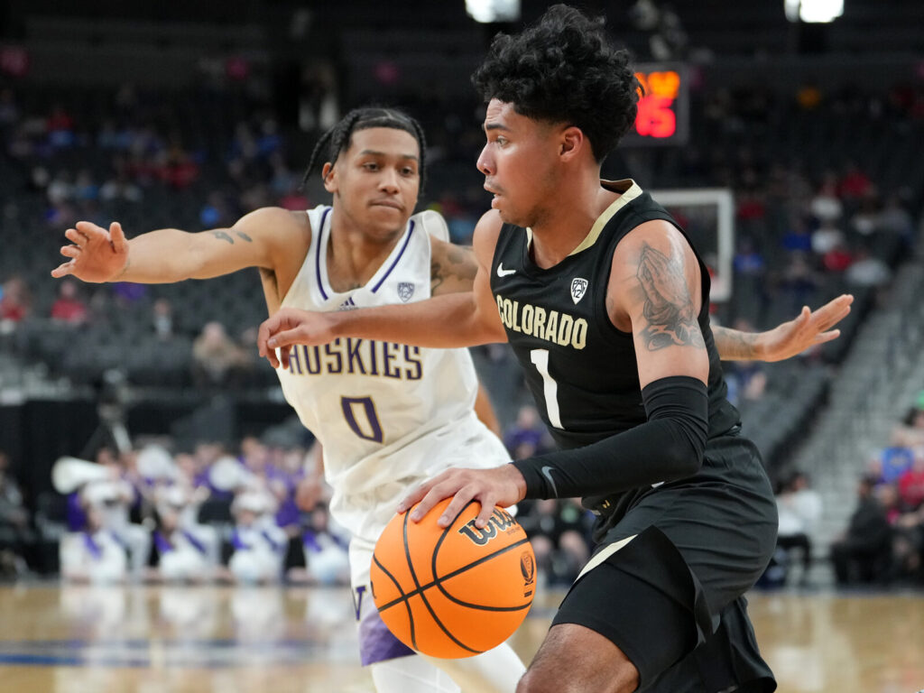 Colorado Buffaloes guard Julian Hammond III (1) dribbles against Washington Huskies guard Koren Johnson (0) during the second half at T-Mobile Arena. CU Buffs