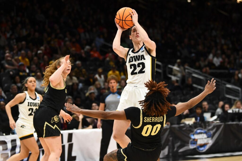 Iowa's Caitlin Clark (22) with the shot attempt while guarded by the Colorado Buffaloes Jaylyn Sherrod (00) during the Sweet 16 of the NCAA college basketball tournament at Climate Pledge Arena in Seattle, WA on Friday, March 24, 2023.