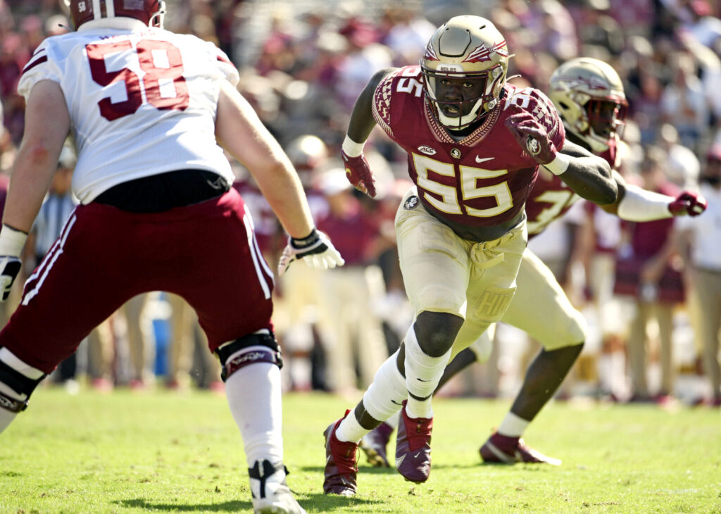 Colorado Buffaloes (CU Buffs) defensive end Derrick McLendon II (55) rushes off the edge during the second half against the University of Massachusetts Minutemen at Doak S. Campbell Stadium.