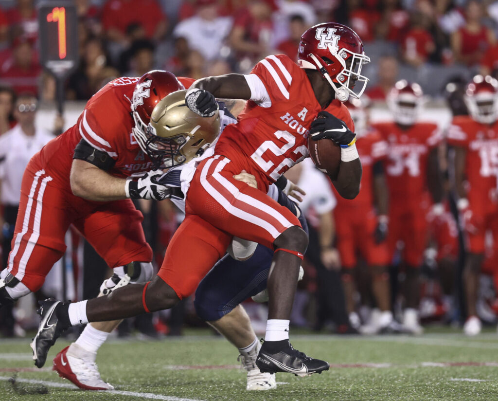 Colorado Buffaloes running back Alton McCaskill (22) runs with the ball during the second quarter against the Navy Midshipmen at TDECU Stadium.