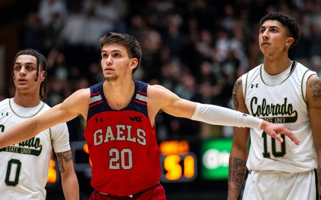 Aiden Mahaney of Saint Mary's blocks out Kyan Evans and Nique Clifford.