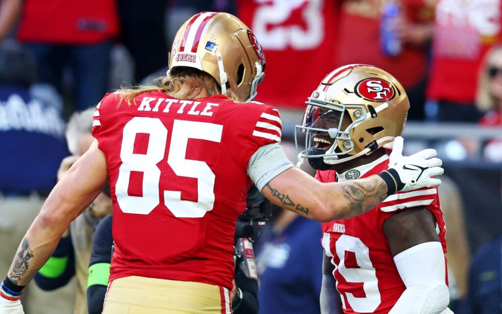 George Kittle and Deebo Samuel celebrate.