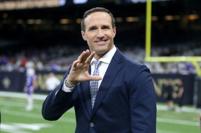 Former New Orleans Saints quarterback Drew Brees waves to fans on the sidelines before the game between the New Orleans Saints and the Buffalo Bills at the Caesars Superdome.