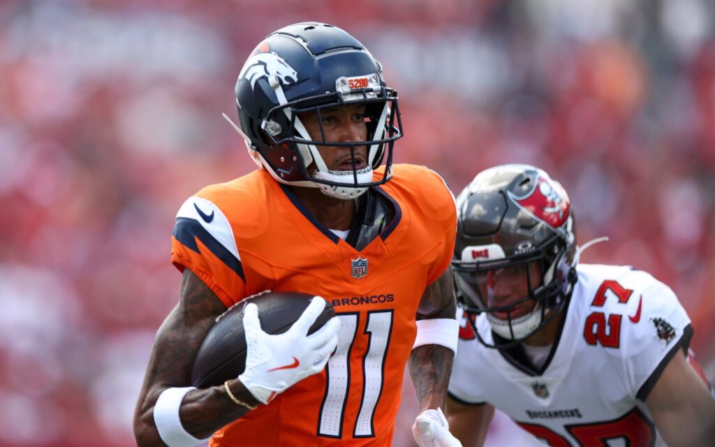 Denver Broncos receiver Josh Reynolds runs after a catch.