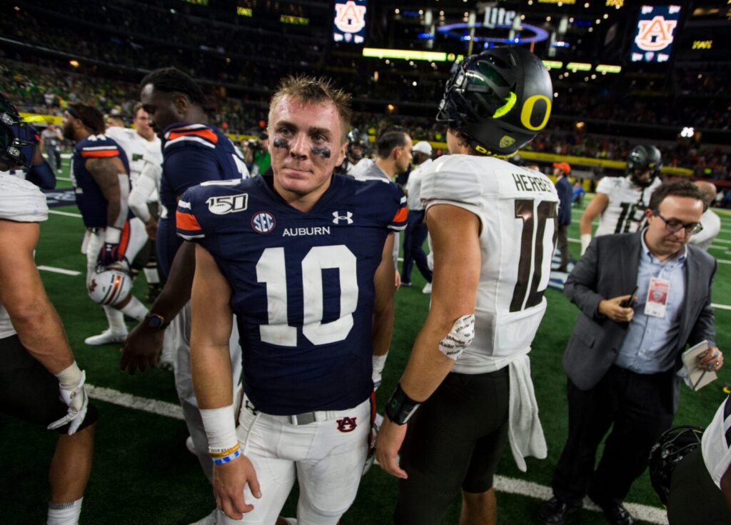 Auburn quarterback Bo Nix (10) shakes hands with Oregon quarterback Justin Herbert (10) after the game at AT&T Stadium in Arlington, Texas, on Saturday, Aug. 31, 2019. Auburn defeated Oregon 27-21.