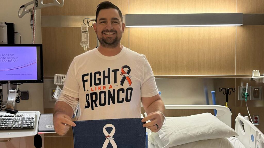 Denver Broncos passing game coordinator Zack Grossi poses for the NFL's Crucial Catch campaign to Intercept Cancer. Photo: Denver Broncos