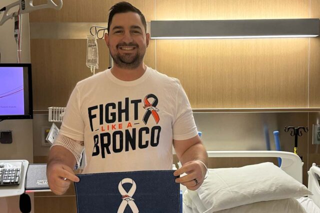 Denver Broncos passing game coordinator Zack Grossi poses for the NFL's Crucial Catch campaign to Intercept Cancer. Photo: Denver Broncos