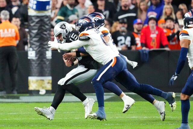 Jonathon Cooper and Cody Barton sack Gardner Minshew.