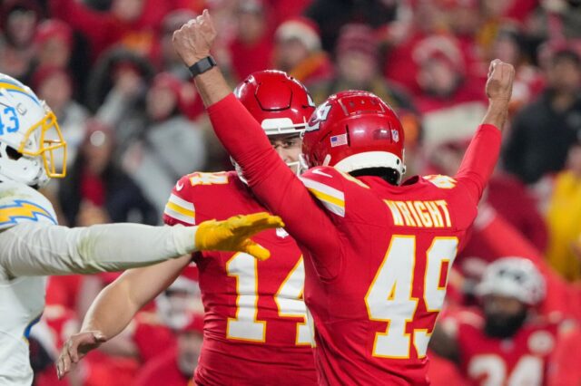 Matthew Wright celebrates with a Chiefs teammate while a Chargers player motions “no good.”