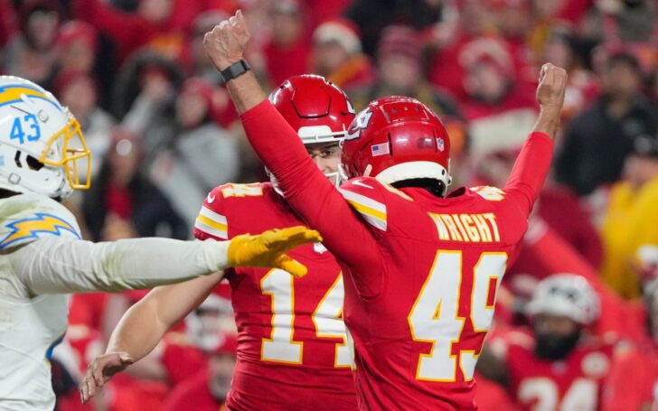 Matthew Wright celebrates with a Chiefs teammate while a Chargers player motions “no good.”