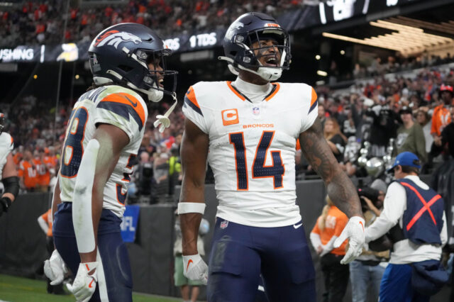 Denver Broncos wide receiver Courtland Sutton (14) celebrates with running back Jaleel McLaughlin (38) after scoring on a 18-yard touchdown pass against the Las Vegas Raiders at Allegiant Stadium.