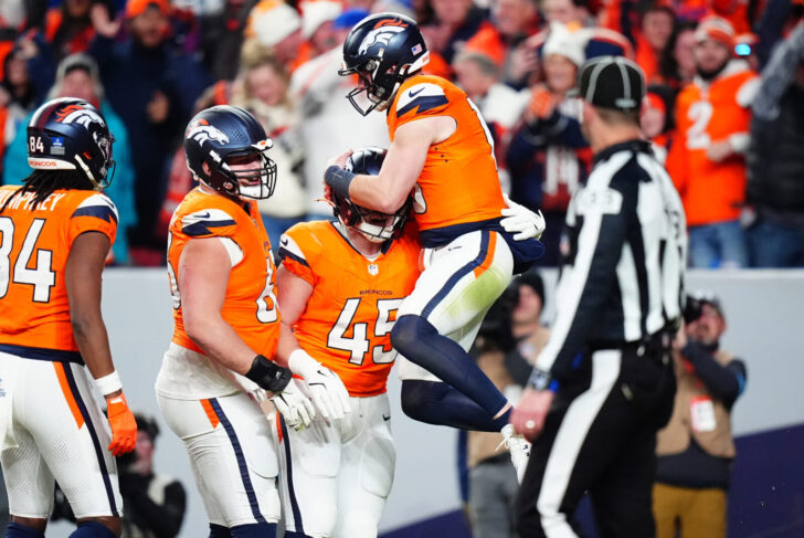 Denver Broncos tight end Nate Adkins (45) celebrates his touchdown with Denver Broncos quarterback Bo Nix (10) and offensive tackle Alex Palczewski (63) in the fourth quarter against the Indianapolis Colts at Empower Field at Mile High.