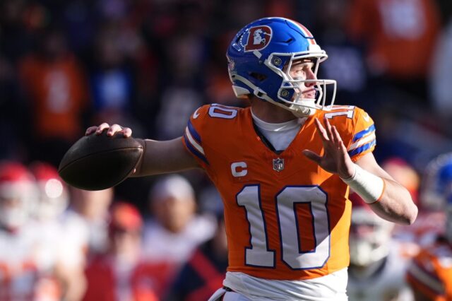 Bo Nix throws against the Chiefs in Week 18. He’s wearing the Broncos throwback 1977 jersey and helmet.