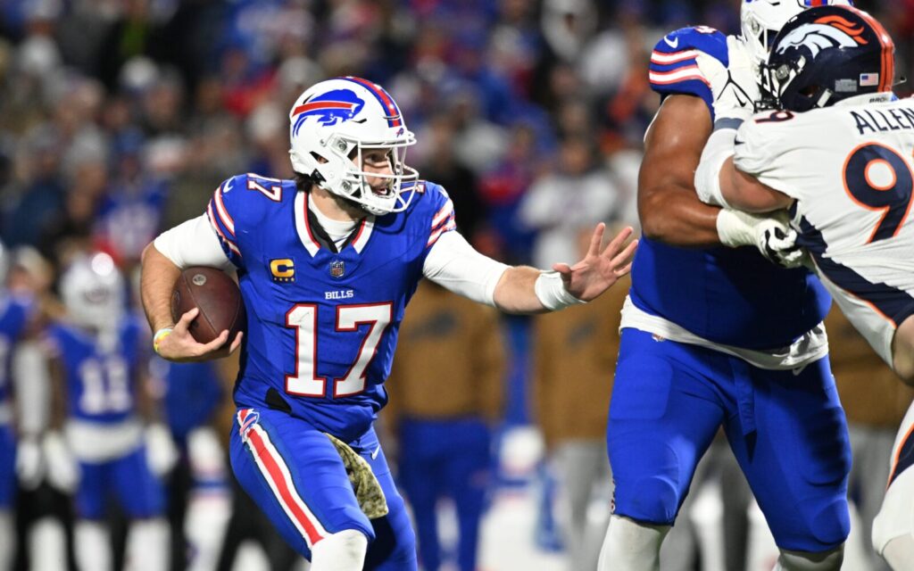 Josh Allen runs against the Broncos in 2023.