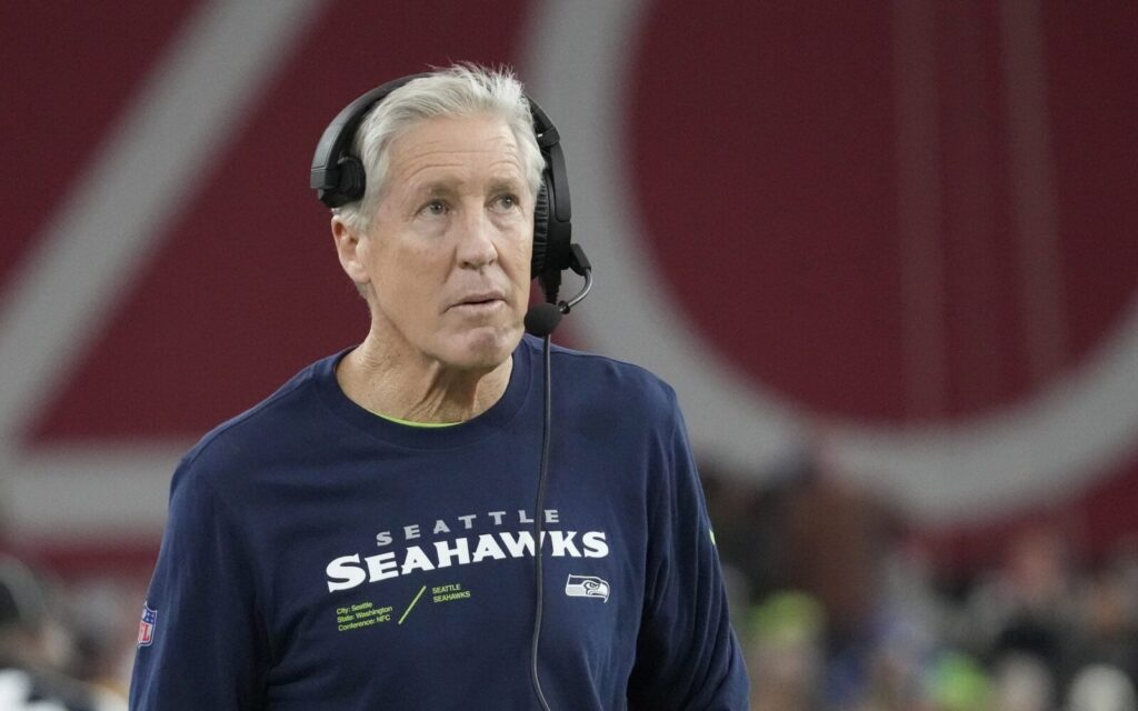 Pete Carroll in a Seahawks shirt on the sideline.