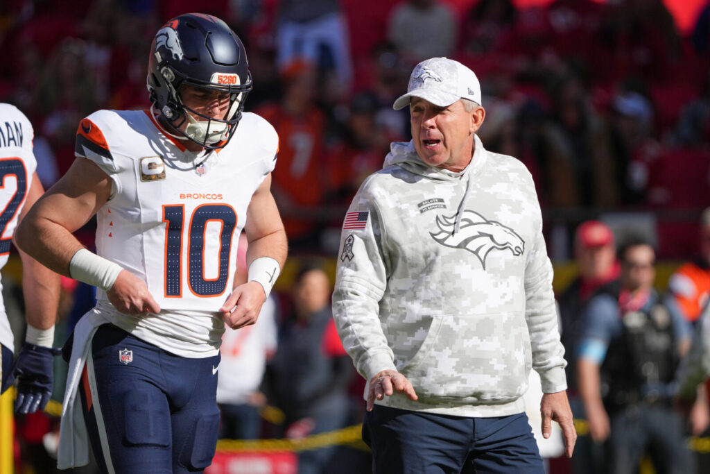 Nov 10, 2024; Kansas City, Missouri, USA; Denver Broncos quarterback Bo Nix (10) talks with head coach Sean Peyton against the Kansas City Chiefs prior to a game at GEHA Field at Arrowhead Stadium.