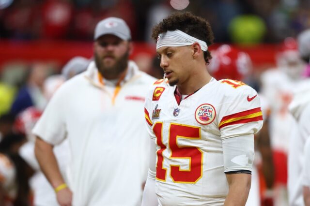 Patrick Mahomes dejected after losing the Super Bowl. A Kansas City staffer is also shown.