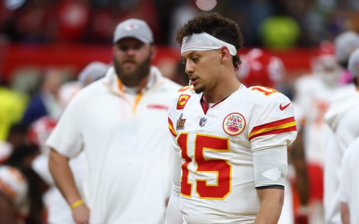 Patrick Mahomes dejected after losing the Super Bowl. A Kansas City staffer is also shown.