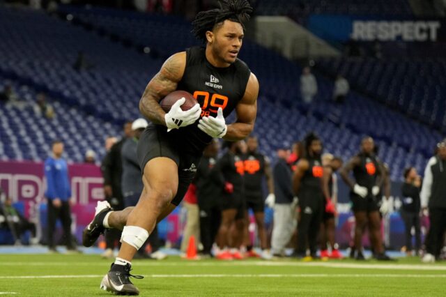 Omarion Hampton runs at the NFL Combine.