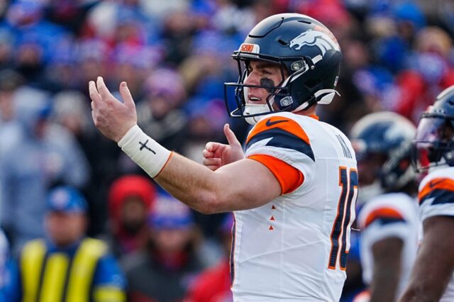 Bo Nix vs. Buffalo calling out a play to a receiver.