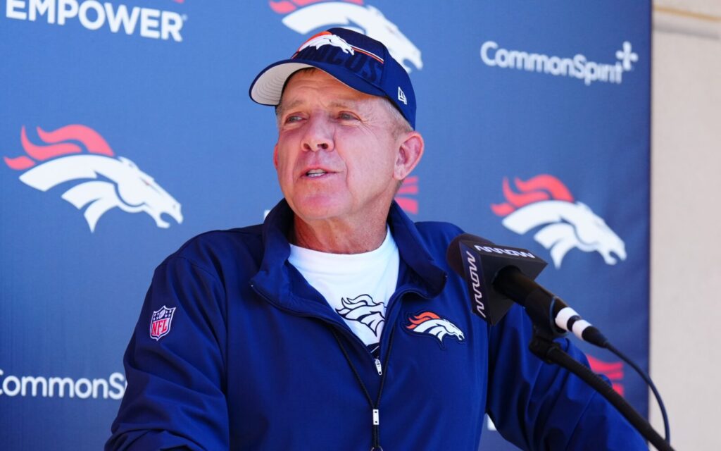 Sean Payton at a podium.
