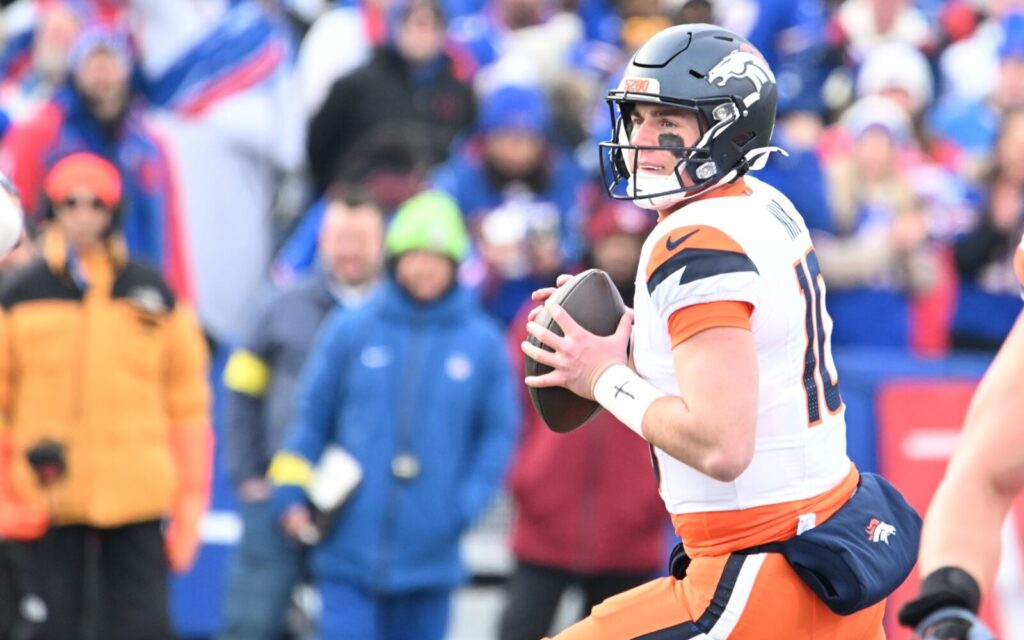 Bo Nix surveys the field against the Buffalo Bills in the playoffs, Jan. 2025.
