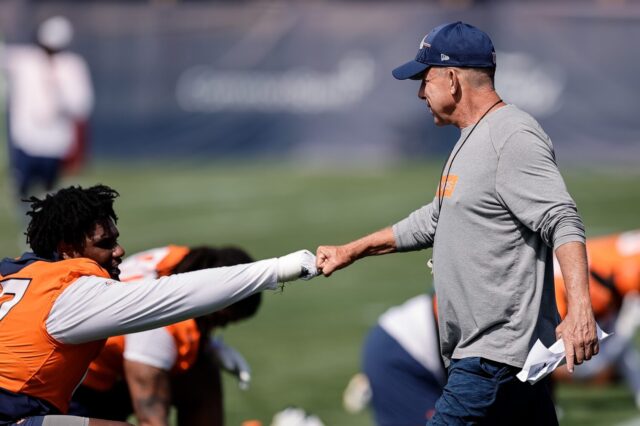 Sean Payton and Malcolm Roach hit knucks at Broncos training camp.