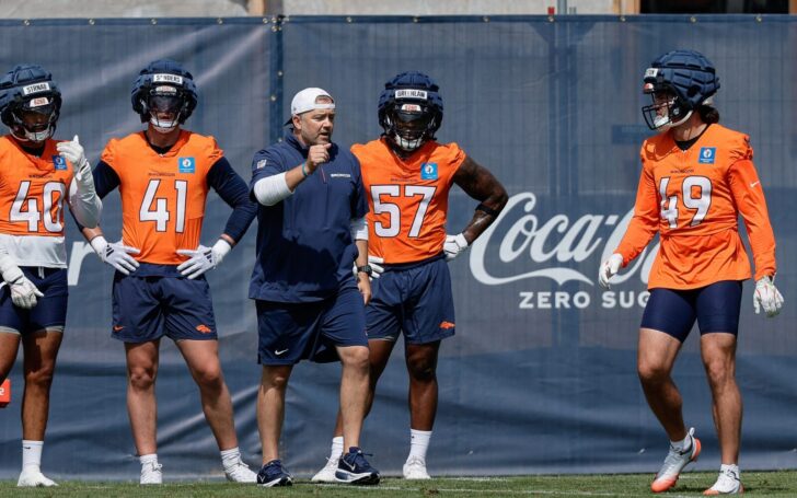 Drew Sanders (41) with Dre Greenlaw (57) and Alex Singleton (49) at training camp practice on July 24.