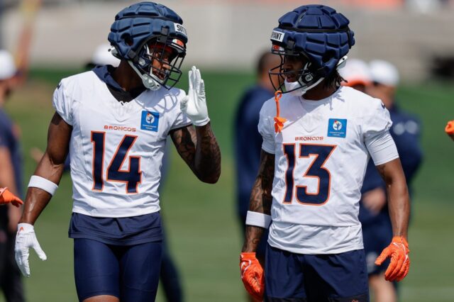 Courtland Sutton talks to rookie Pat Bryant on Thursday, July 24 at Broncos training camp.