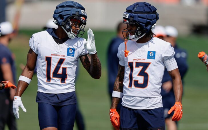 Courtland Sutton talks to rookie Pat Bryant on Thursday, July 24 at Broncos training camp.