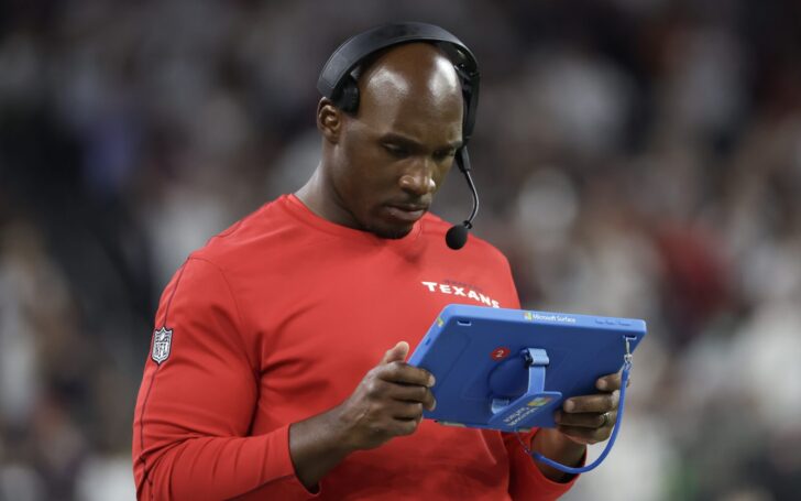 DeMeco Ryans, Texans Head Coach, uses a Microsoft tablet on the sideline of a game in 2024.