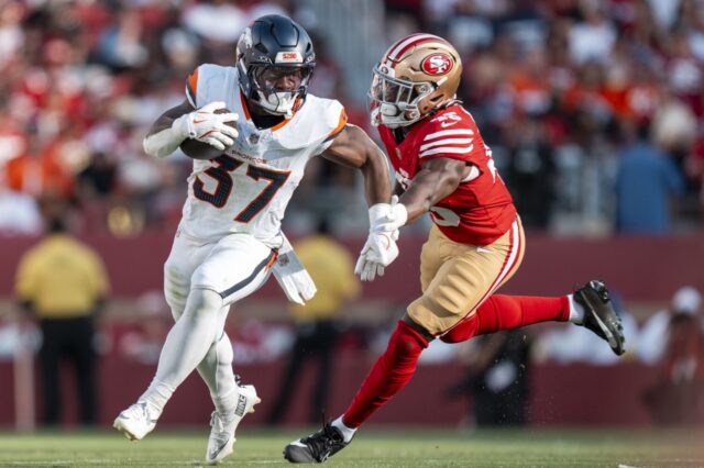 R.J. Harvey runs around a 49ers defender in the Denver Broncos first preseason game.