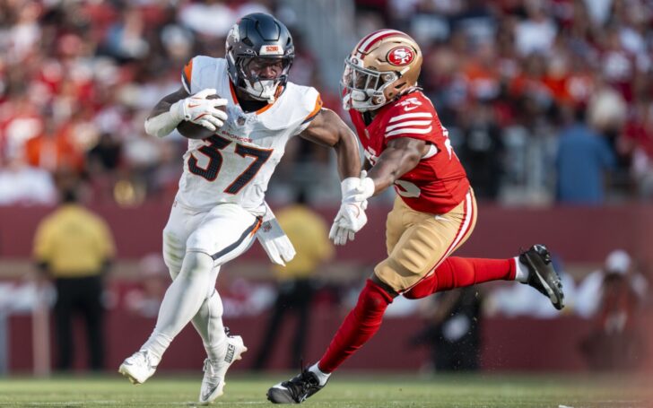 R.J. Harvey runs around a 49ers defender in the Denver Broncos first preseason game.