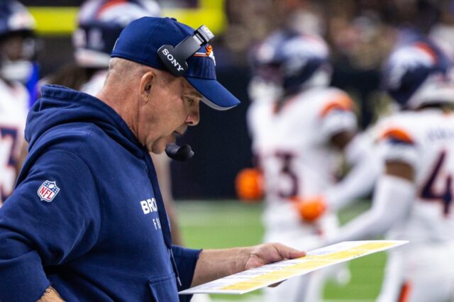 Sean Payton on the sideline calling a play.