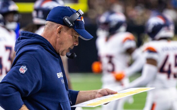 Sean Payton on the sideline calling a play.