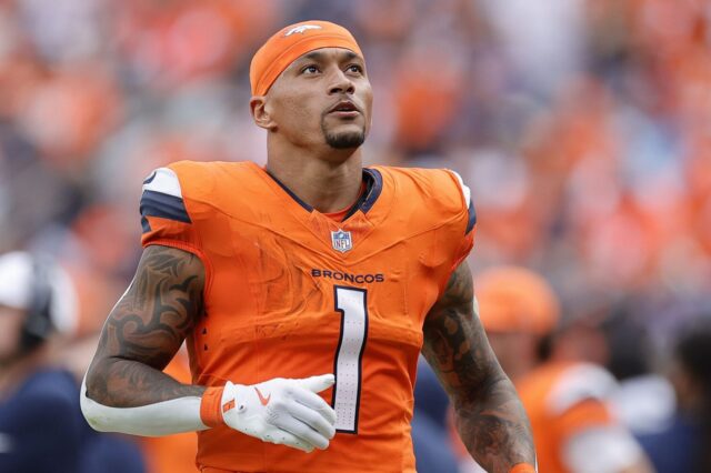 Evan Engram before the Broncos-Titans game Week 1. He's wearing the Broncos home orange and an orange headband.