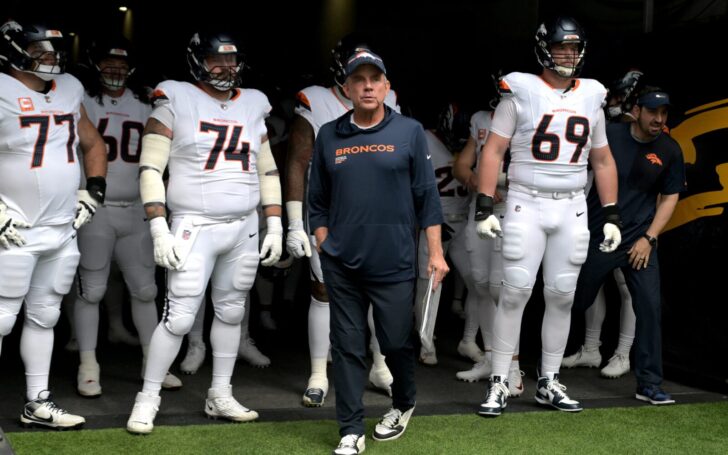Sean Payton leads the Broncos onto the field against the Chargers.