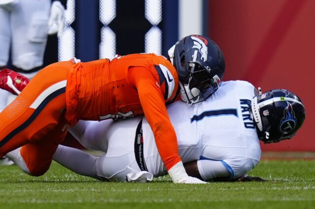 Nik Bonitto sacks Cam Ward in Week 1.