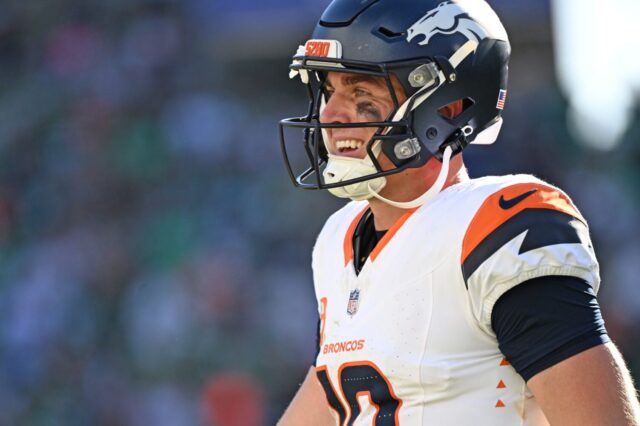 Bo Nix smiles at the end of the Broncos - Eagles game.