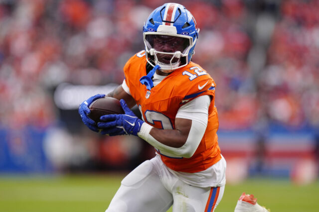 Broncos running back R.J. Harvey runs for his third touchdown of the day.