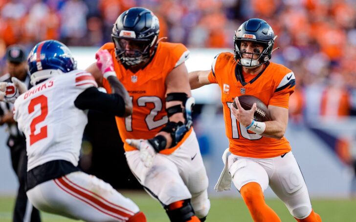 Garett Bolles blocks for Bo Nix against the Giants on one of Nix's touchdown runs.