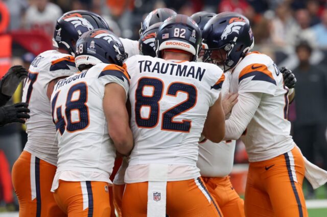 Denver Broncos celebrate the win with Wil Lutz.