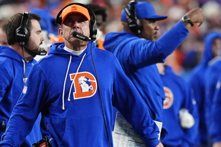 Sean Payton on the sideline of Broncos-Raiders in the throwback Broncos D logo sweatshirt.
