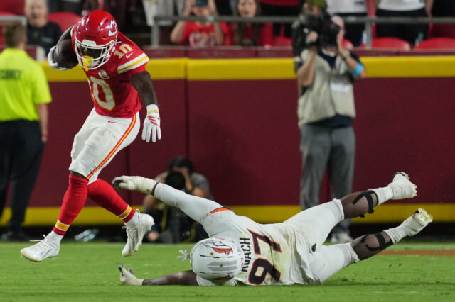 Malcom Roach stiff-armed by Emmett Johnson.
